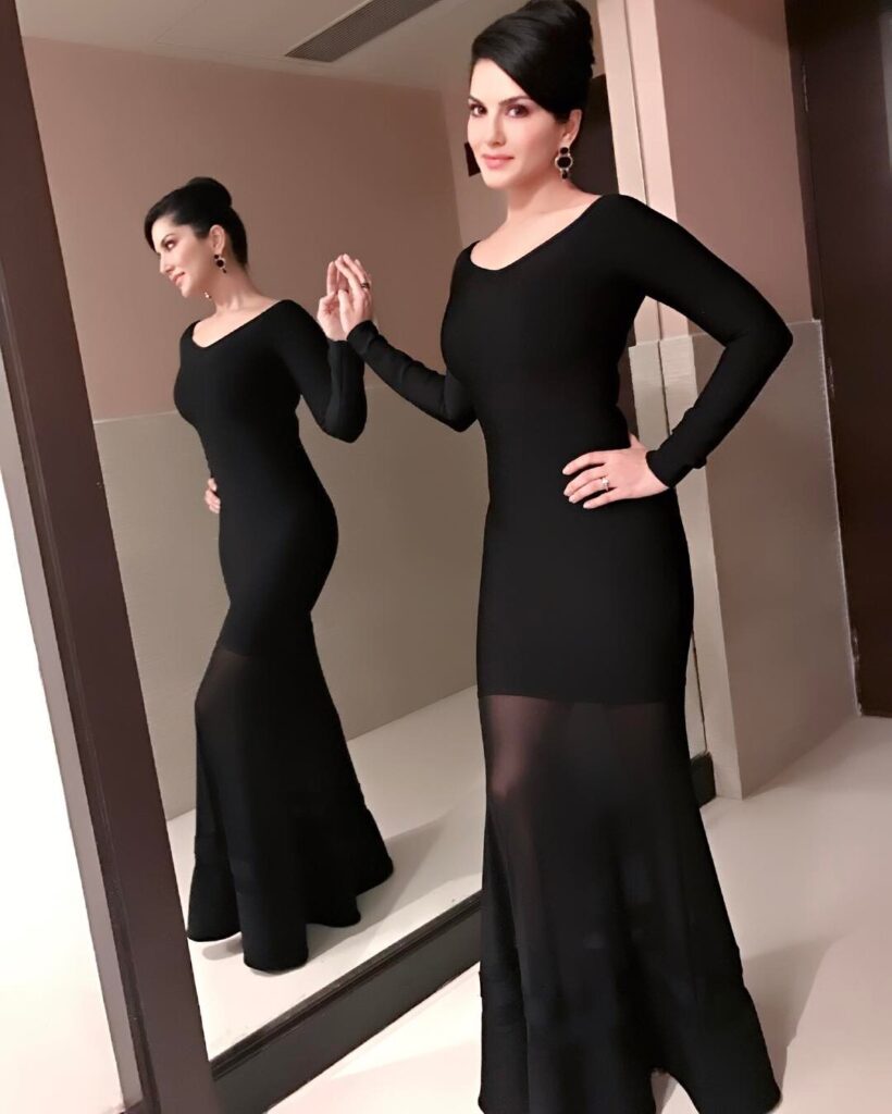 A certain hot bollywood actress Continues Her Love For Black As She Wears Evening Gown - 0