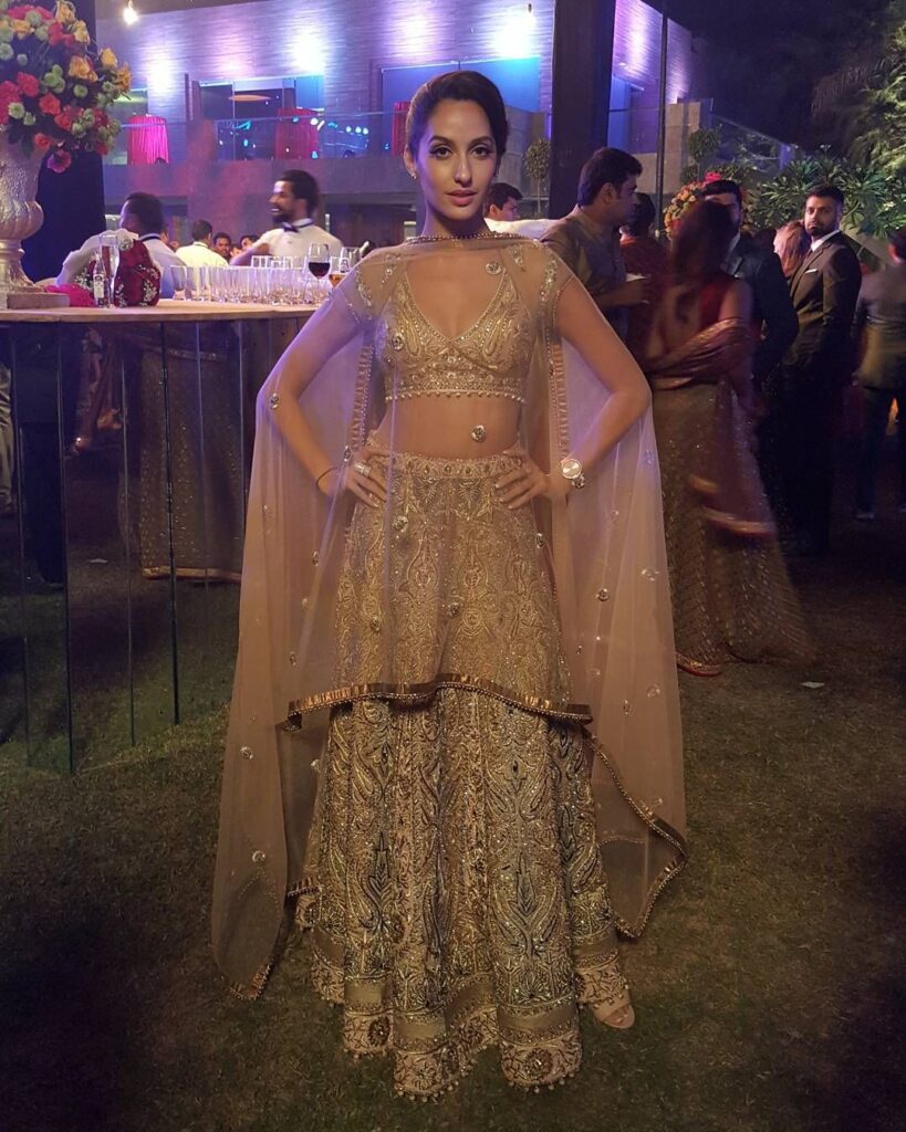 Check Out! How Nora Fatehi, Aishwarya Rai Bachchan To Jacqueline Fernandez Styled Their Looks In Golden Lehenga - 0