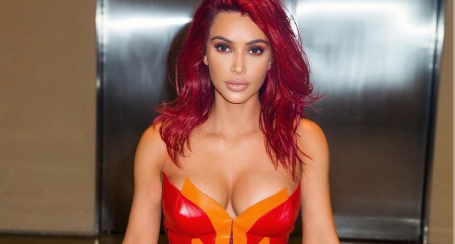 Red Hot: Kim Kardashian's latest strapless red shimmery outfit will make you feel the heat