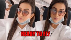 Watch Akshara Singh As She Takes A Flight Covered With Safety Clothes