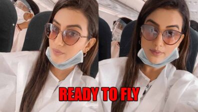 Watch Akshara Singh As She Takes A Flight Covered With Safety Clothes