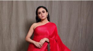 Amruta Khanvilkar Opted for A Stripped Red Gown Cum Saree for Filmfare Awards 2021!