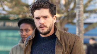 Kit Harrington Looks Stunning In Blue Rib Knit Tshirt With Brown Jacket