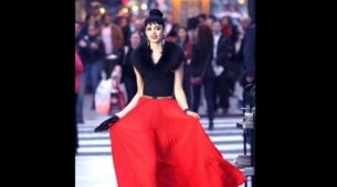 Krysten Ritter In Black Top And Red Pleated Skirt Looks Pretty