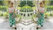 Emma Robert styles her simple white tee with a gorgeous green skirt, have a look