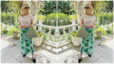 Emma Robert styles her simple white tee with a gorgeous green skirt, have a look