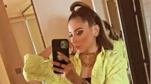 Kanika Kapoor Makes Style Statement In Black With Yellow Shirt And Black Knee Length Boots