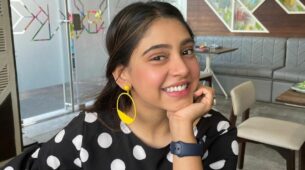 Niti Taylor looks pretty in a polka dot outfit with a pop of yellow earrings