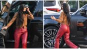 Kourtney Kardashian looks gorgeous in red leather pants and a brown sweater