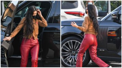 Kourtney Kardashian looks gorgeous in red leather pants and a brown sweater