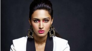 Erica Fernandes is stealing thunder as she wears a white pantsuit with statement earrings that look effortlessly majestic