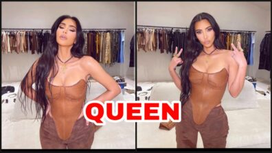 What A Hottie: Kim Kardashian burns the swag game with her brown leather strapless V outfit, fans can’t stop crushing