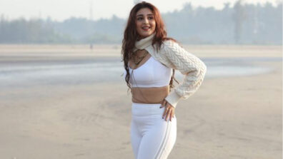 Dhvani Bhanushali looks bomb at the beach in a white slim trousers & sports bralette, fans feel the heat