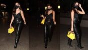 Spotted Alert: Nora Fatehi spotted at the airport in her flawless black leather pant & stripy top with her yellow handbag, view pics