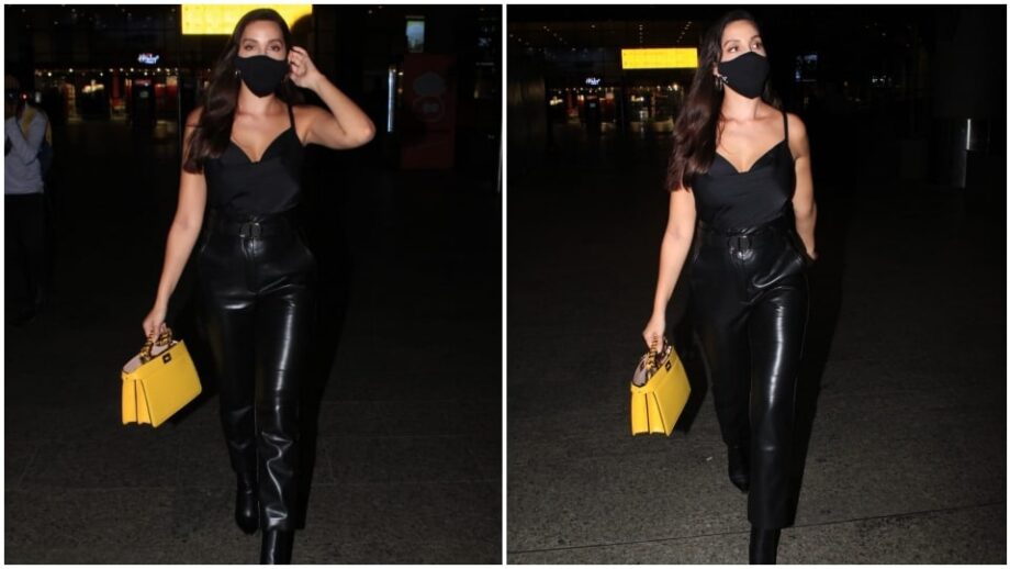 Spotted Alert: Nora Fatehi spotted at the airport in her flawless black leather pant & stripy top with her yellow handbag, view pics - 1