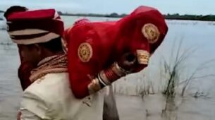 Unusual Journey Back Home! A Groom Lifts His Wife On His Shoulder To Avoid The Muddy Waters
