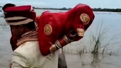 Unusual Journey Back Home! A Groom Lifts His Wife On His Shoulder To Avoid The Muddy Waters