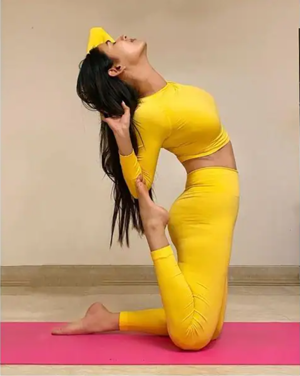 Bend It Like Her! Sonal Chauhan Grabs Eyeballs As She Performs Yoga Asanas In Yellow Outfit - 2