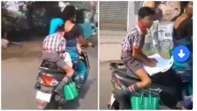 ROFL: A Young Boy Doing His Homework Sitting On The Back Of The Scooter Has Emerged On Social Media, Watch The Viral Video To Get Entertained