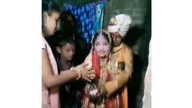 An Excited Bride Tosses The Rice High In Air During Her Bidaai Ceremony