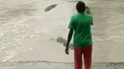 OMG: A video of a woman using her flip-flop to scare away a crocodile has gone viral, Watch