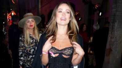 What a beauty! Olivia Wilde looked fabulous in a sheer cutout corset with a tan midi skirt, see here