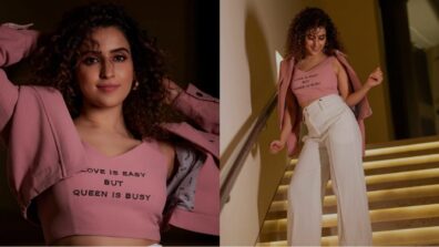 Queen Sanya Malhotra has no time for love as she poses in pink crop top and white flared pant