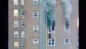 Triggered Alert! A terrifying video of two teenagers dangling from a window of a burning building has gone viral, Watch