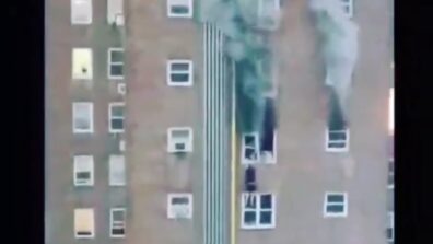 Triggered Alert! A terrifying video of two teenagers dangling from a window of a burning building has gone viral, Watch