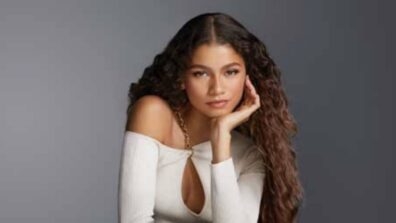 For A Lancome Ad, Zendaya Looks Flawlessly Beautiful With A Keyhole Sweater And Curly Hair