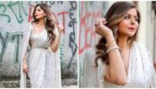 Kanika Kapoor looks ravishing in a Manish Malhotra sequin saree with an exaggerated drape bodice and Swarovski crystal belt, see pics