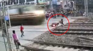 Watch A Motocross Rider Narrowly Avoid Getting Hit By A Rushing Train While Attempting To Cross Tracks, Tap Here