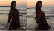 Ashnoor Kaur looks resplendent in her classic beach maroon midi dress