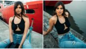 Malavika Mohanan looks sultry in black crop top and denim jeans