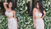 Mouni Roy dazzles in a white plunging neckline bralette, gets surrounded by beautiful white flowers
