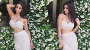 Mouni Roy dazzles in a white plunging neckline bralette, gets surrounded by beautiful white flowers