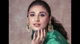 Traditional Beauty: Dhvani Bhanushali keeps it chic and gorgeous in embellished green-lilac lehenga choli