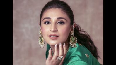 Traditional Beauty: Dhvani Bhanushali keeps it chic and gorgeous in embellished green-lilac lehenga choli