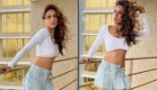 Haye Garmi: Nia Sharma activates chic mode, looks super sensuous in white crop top and unbuttoned denim shorts