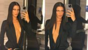 Bella Hadid Shows-Off Her Sultry Body In A Veru Low-cut Silk Shirt From The Backstage During Milan Fashion Week, Take A Look