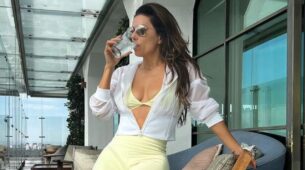 In a matching combination of a yellow bra and biking shorts, Eva Longoria displays her amazing body