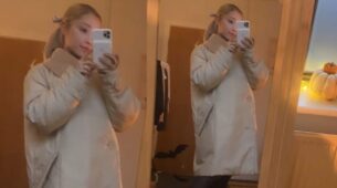 Blonde Babe Ariana Grande looks bossy in beige overcoat and black pants
