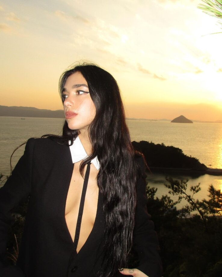 Photodump: Dua Lipa explores Naoshima, Japan in plunging shirt dress - 0