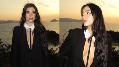 Photodump: Dua Lipa explores Naoshima, Japan in plunging shirt dress