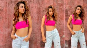 Nia Sharma flaunts curvaceous midriff in pink bralette and denims, we are sweating