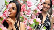 Jasmin Bhasin is a floral muse in a striped halter-neck black dress