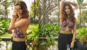Rhea Chakraborty looks ravishing in a halter-neck crop top and fringed pants