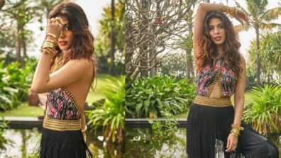 Rhea Chakraborty looks ravishing in a halter-neck crop top and fringed pants