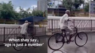 Viral Video: A Old Man Freely Enjoys Riding A Bicycle On A Wet Road Is Going Viral On Web