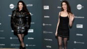 Anne Hathaway Shows Off Toned Legs In A Black Mini Dress With Black Puffer Jacket at Sundance Film Festival